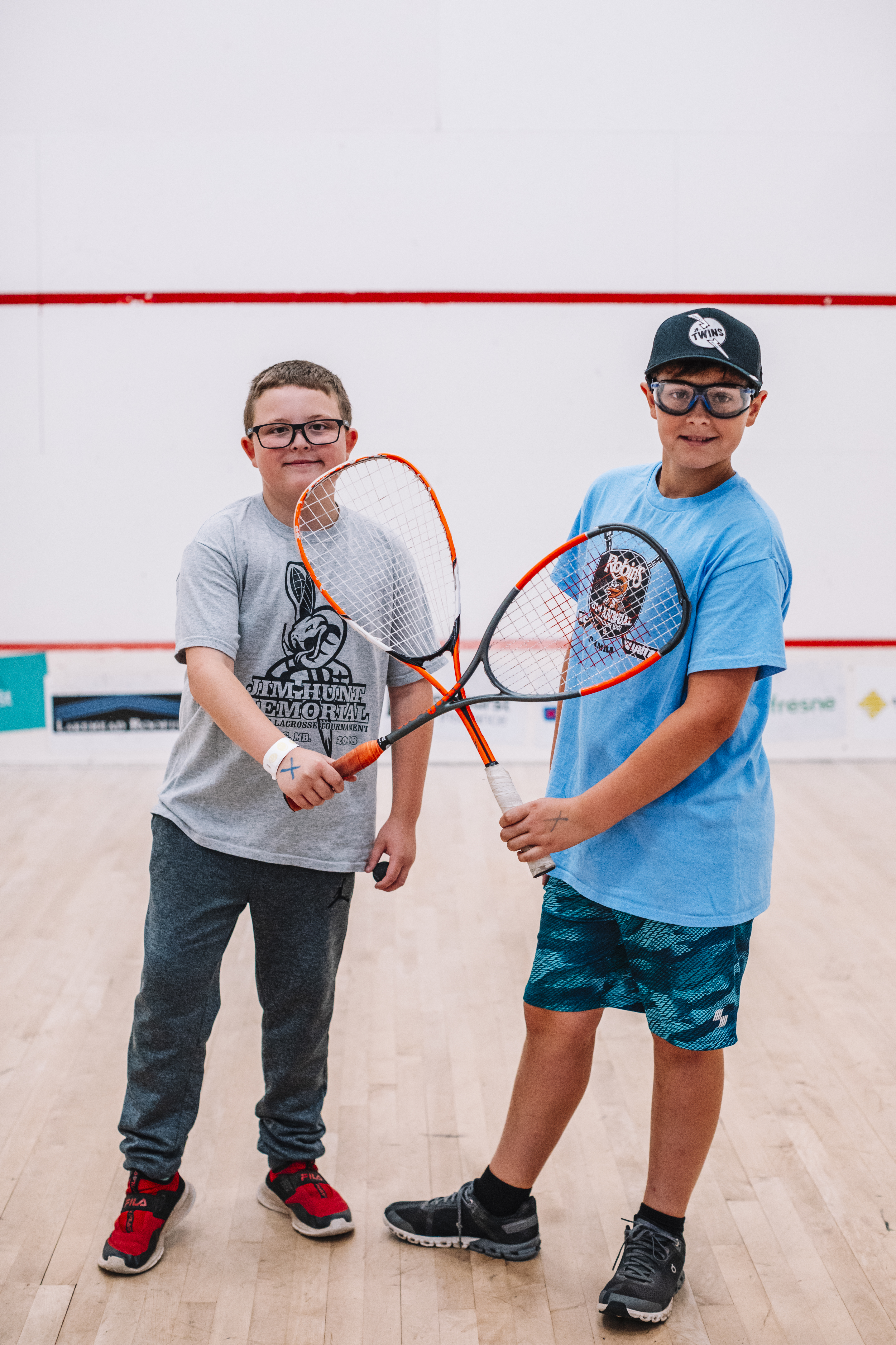 kids playing squash kids playing squash